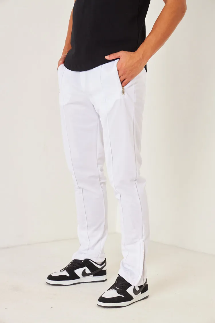 Pantalon de jogging blanc satiné zippé aux chevilles