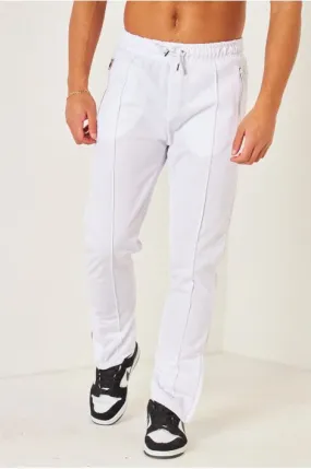 Pantalon de jogging blanc satiné zippé aux chevilles