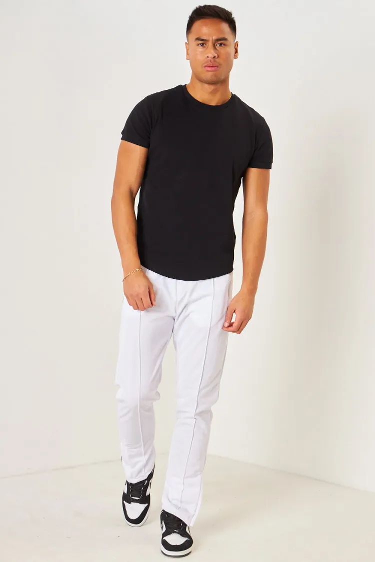 Pantalon de jogging blanc satiné zippé aux chevilles