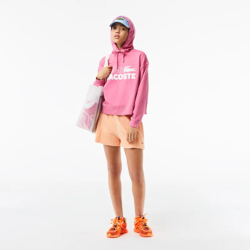 SWEATSHIRT À CAPUCHE FEMME LACOSTE OVERSIZE FIT ROSE AVEC MARQUAGE CONTRASTÉ